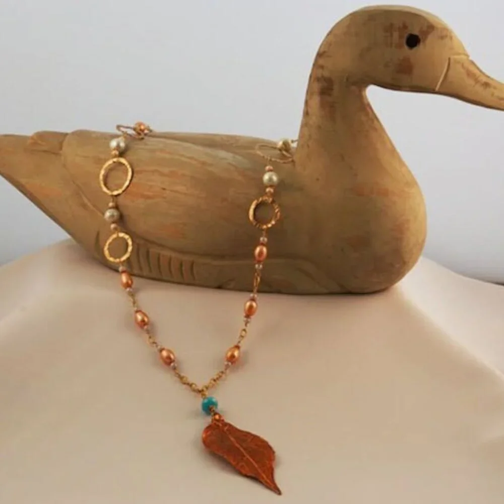 Hand made gold necklace with‎ gold and blue fresh water pearls
